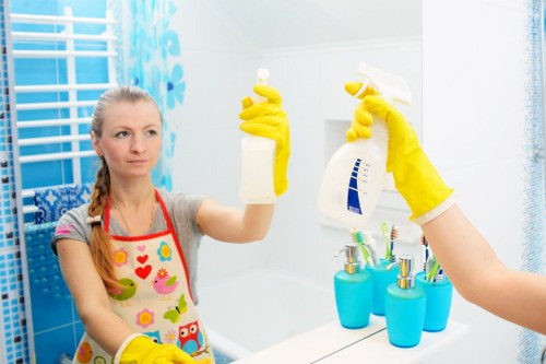 Professional carpet cleaners preparing a living room carpet for deep cleaning in Stepney
