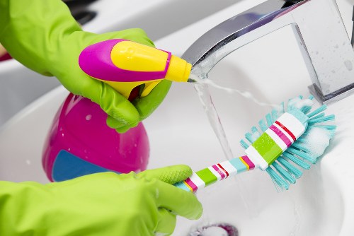 Technician handling carpet cleaning machinery with care